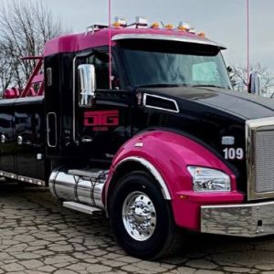 magenta and black tow truck